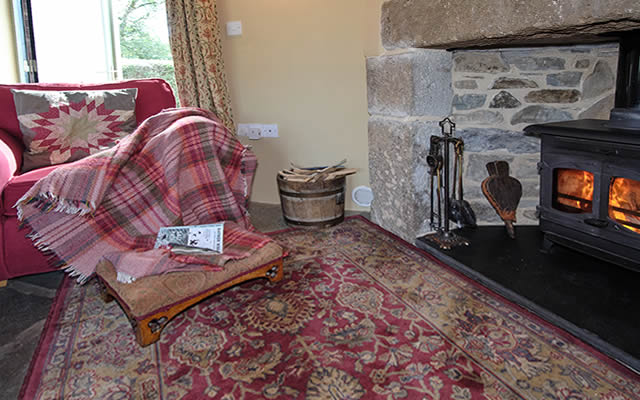 Monkstone Cottage - cosy lounge with woodburning stove