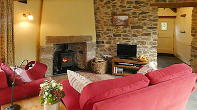 Monkstone Cottage - large cosy lounge with woodburner stove
